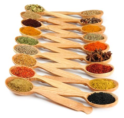 Premium Photo Assortment Of Spices In Wooden Spoons Isolated On White