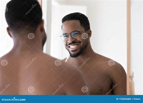 Head Shot Mirror Reflection Smiling African American Man Brushing Teeth