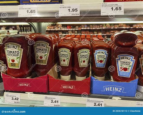View Of A Shelf With Different Types Of Ketchup In A Supermarket