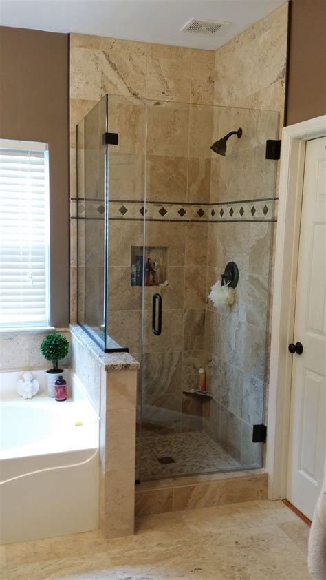 A Bathroom With A Walk In Shower Next To A Bathtub