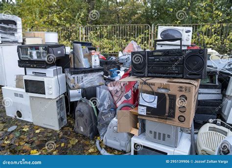 Electronic Waste Awaiting Recycling A Pile Of Garbage In Nature Green