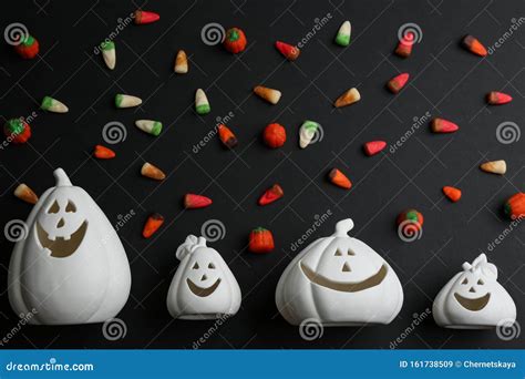 Jack-o-Lantern Candle Holders and Jelly Candies on Black Background ...