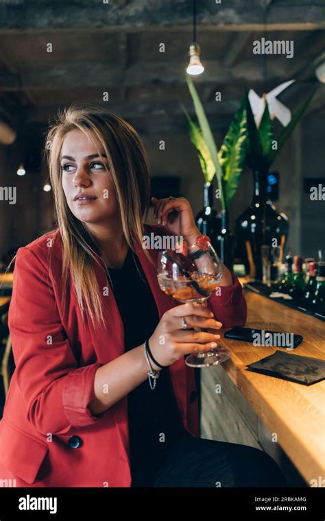 Blonde Girl In A Cocktail Bar Stock Photo Alamy