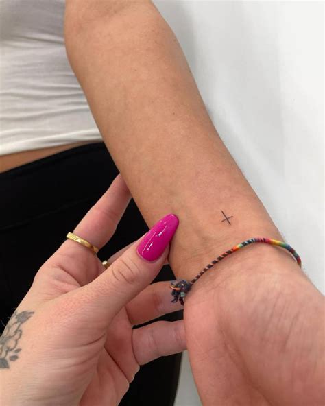 Tiny Minimalistic Cross Tattoo Done On The Wrist