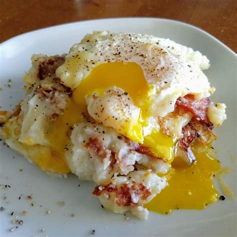 Leftover Mashed Potatoes Pan Fried Layered With Bacon And Cheddar And An Over Easy Egg