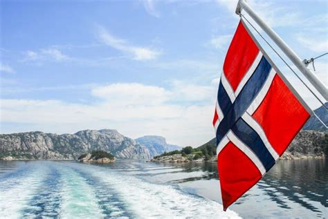 Premium Photo Norwegian Flag Over Sea Against Sky