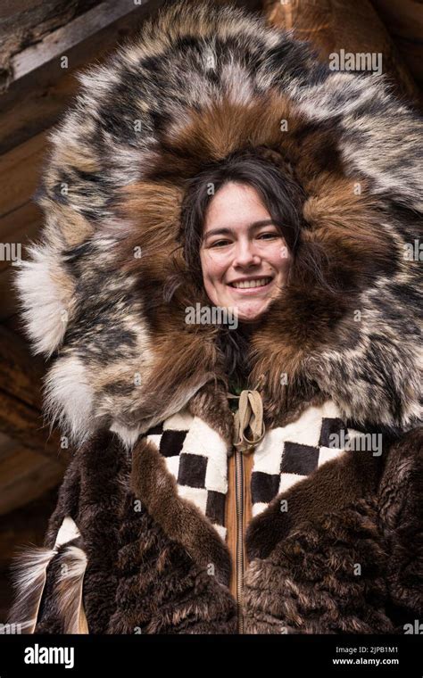 An Athabaskan Girl poses in native costume at the Chena Indian Village ...