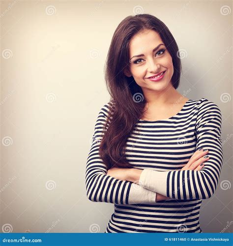 Beautiful Confident Casual Woman With Folded Hands Looking Happy Stock