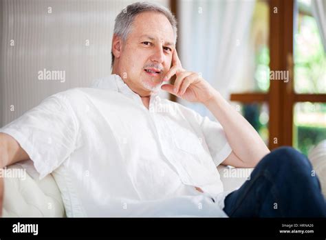 Portrait Of An Happy Mature Man Relaxing On The Couch Stock Photo Alamy