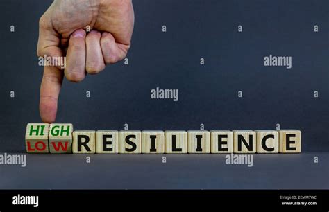 High Or Low Resilience Symbol Businessman Hand Turns Cubes And Changes