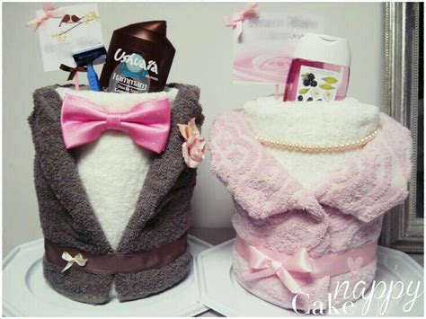 Two Cakes Made To Look Like Sweaters And Bow Ties One With A Pink Bow Tie