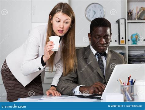 Friendly Coworkers Working Together Stock Image Image Of Indoors