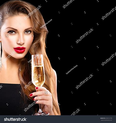 Sexy Model Girl With Glass Of Champagne At Party Drinking Champagne Over Holiday Glowing