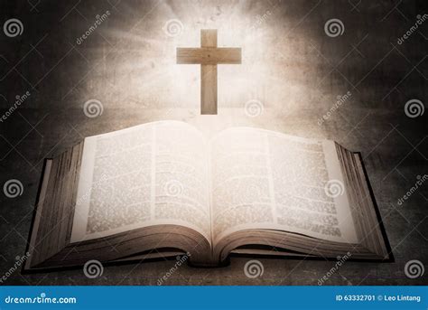 Cross With Open Holy Bible On Table With World Map Blur Background