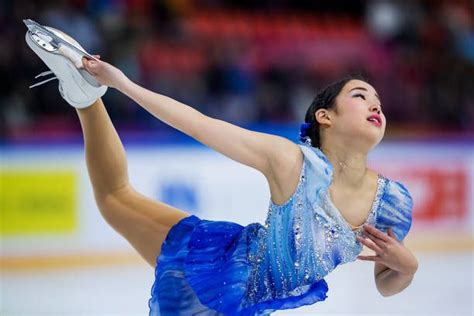 The Figure Skater Is Performing Her Routine For The Olympics