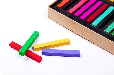 Premium Photo Close Up Of Multi Colored Crayons By Box On White