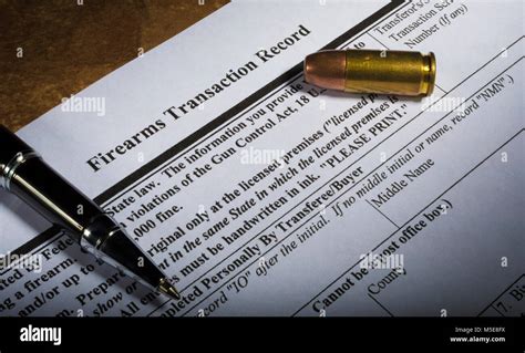 Nics Background Check Form From The Fbi With Pen And Cartridge Stock