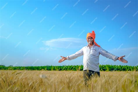 Premium Photo Happy Indian Farmer Walking And Spreading His Arms In