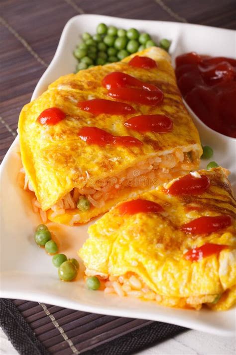 Japanese Omelet With Rice Omurice Close Up On A Plate Vertical Stock