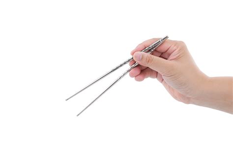 Man S Hand Holding Stainless Steel Chopsticks On Transparent Background