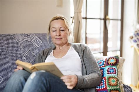 Beautiful Mature Woman Reading Book Feeling Cozy And Happy Weekend