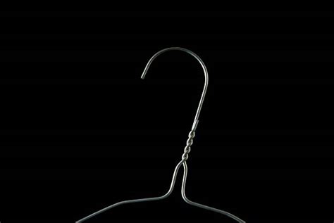 Best Wire Coat Hanger Stock Photos, Pictures & Royalty-Free Images - iStock