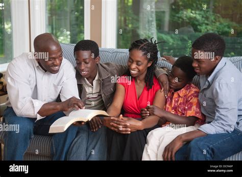 A Christian Family Reading Bible Stock Photo - Alamy