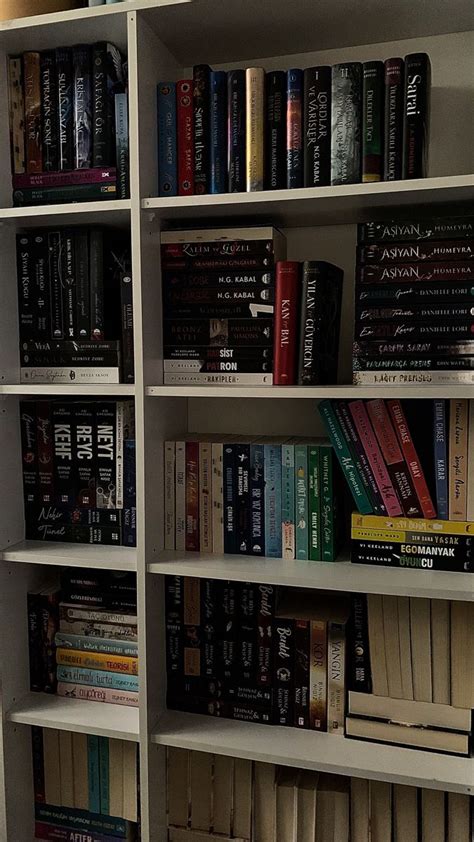 A Bookshelf Filled With Lots Of Different Types Of Books On Top Of Each