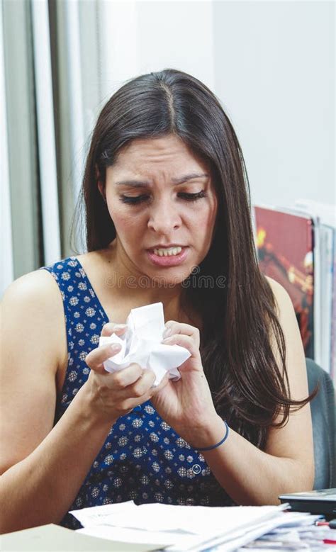 Hispanic Brunette Sitting By Office Desk Holding Stock Photo Image Of