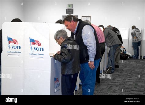 People Vote In Cardboard Voting Booths At A Polling Station In Boise