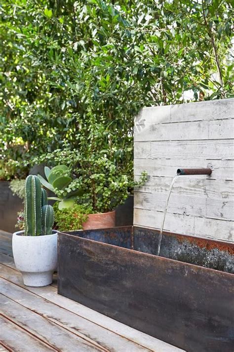 Trough galvanized metal water fountain brings a rustic appeal to a ...