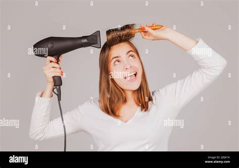 Funny Woman With Hair Dryer Beautiful Girl With Straight Hair Drying