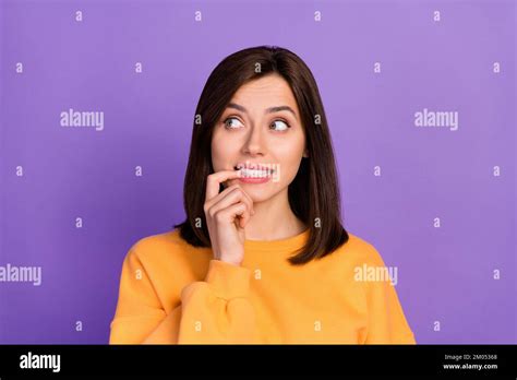 Closeup Photo Of Young Pretty Cute Woman Wear Orange Sweater Bite Nails