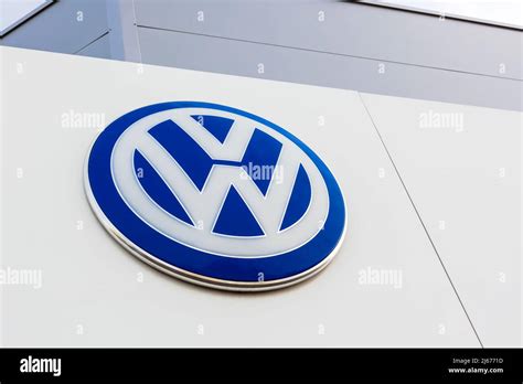 Volkswagen Brand Logo On Bright Blue Sky Background Located On Its