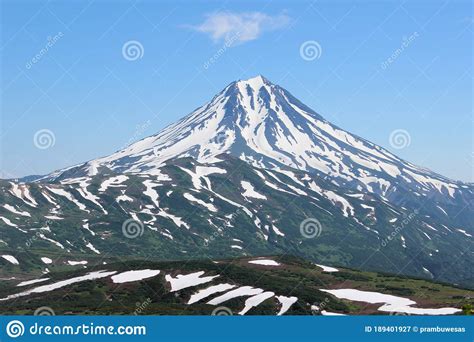 Volcanic Landscape Of Kamchatka Peninsula A Small Cloud Above The