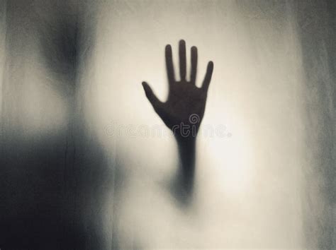 Scary hand in the window. stock image. Image of window - 134505073