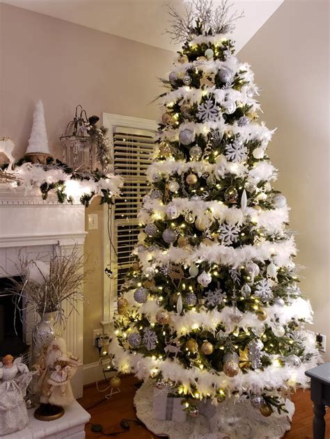 A White Christmas Tree With Lights And Ornaments