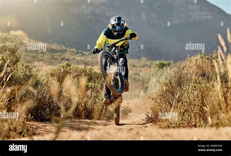 Mountain Biker Dirt Bike And Dessert Rider Cycling On Sports Bicycle