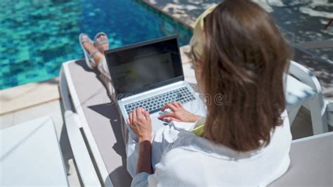 Faceless Female Using Laptop Computer Online Internet While Lying On