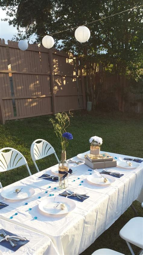 Navy Blue Graduation Table Setup Outdoor Backyard White Tablecloth