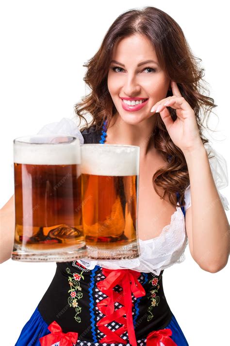 Premium Photo Beautiful Young Brunette Girl In Dirndl Drinks Out Of