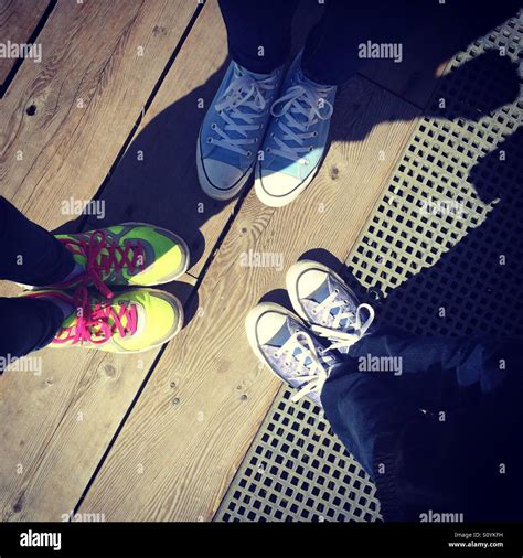 Three Pairs Of Shoes On A Dock Stock Photo Alamy