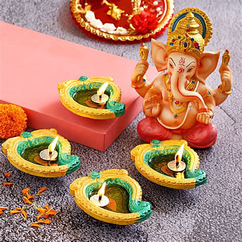 Buy Send Mango Shaped Diyas Pink Dhoti Ganesha Idol Online Fnp