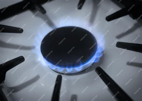 Premium Photo Gas Burner With Blue Flame On Domestic Stove