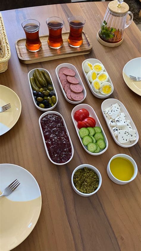 The Table Is Set With Many Different Foods And Drinks On It Including