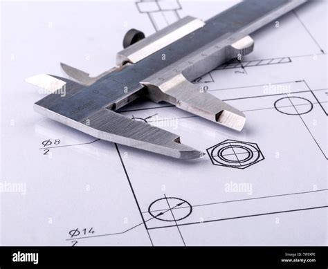 Old metal caliper and engineering drawing Stock Photo - Alamy