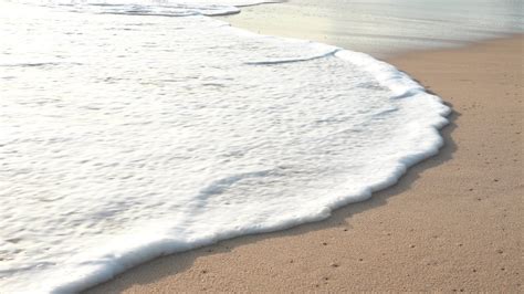 Playa De Arena Oceánica Y Textura De La Superficie Del Agua Olas