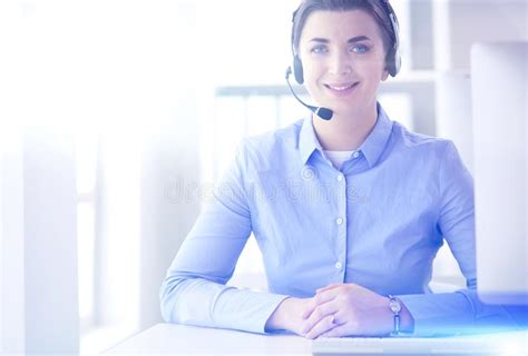 Serious Pretty Young Woman Working As Support Phone Operator With