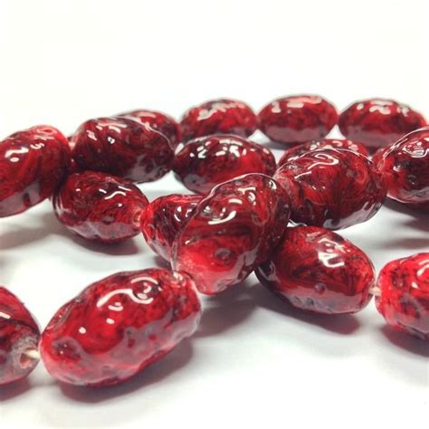 These Opaque Dark Red With Black Marble Matrix Oval Beads Measure