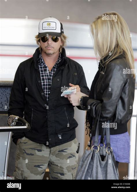 David Spade And His Girlfriend Jillian Grace Arrive At Lax To Catch An